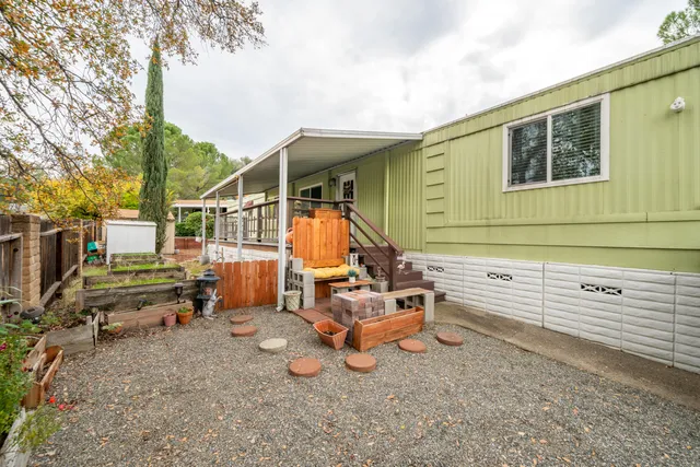 a view of a backyard with chairs