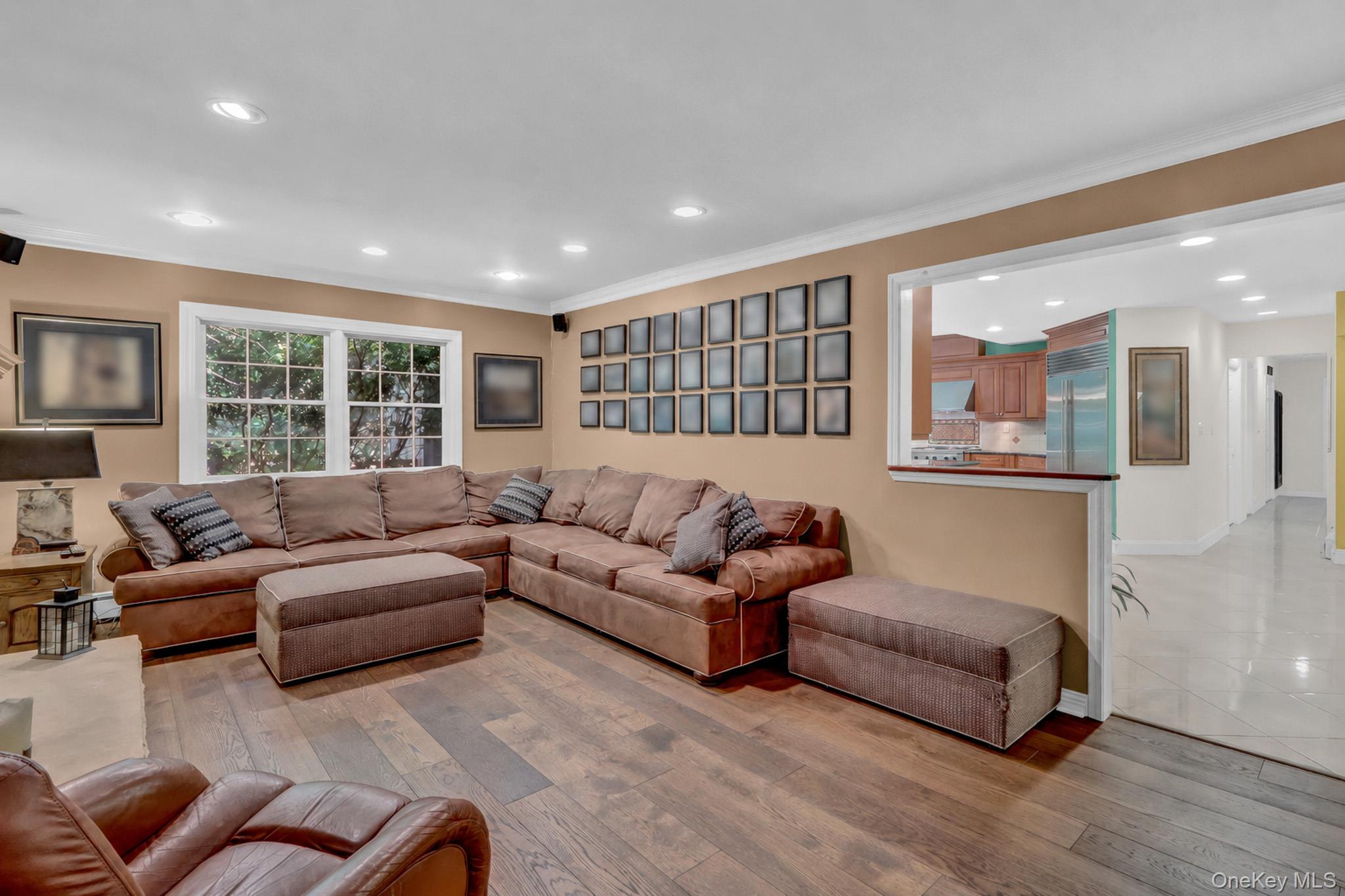 15 Stillwater Road Nissequogue, NY 11780 - Photo 6 of 43 Spacious living area featuring wood-finish flooring, recessed lighting, and a white window frame
