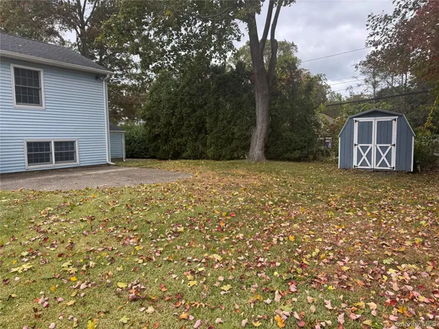 a house that has a tree in front of it