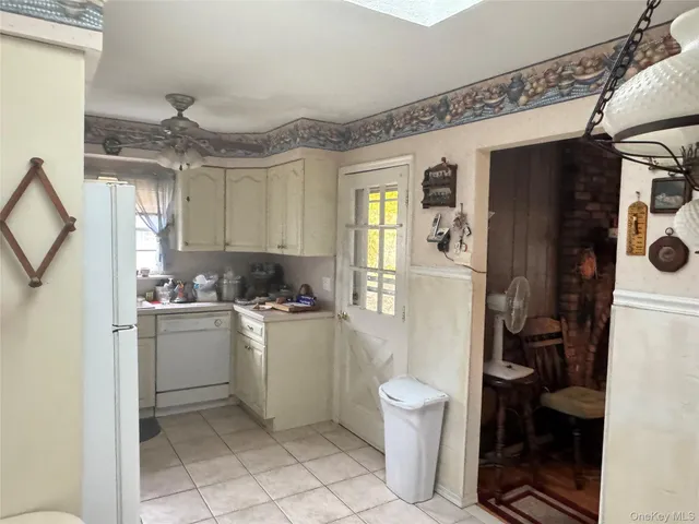 a kitchen with a sink appliances and cabinets