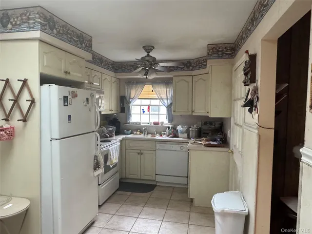 a kitchen with a refrigerator a sink and dishwasher