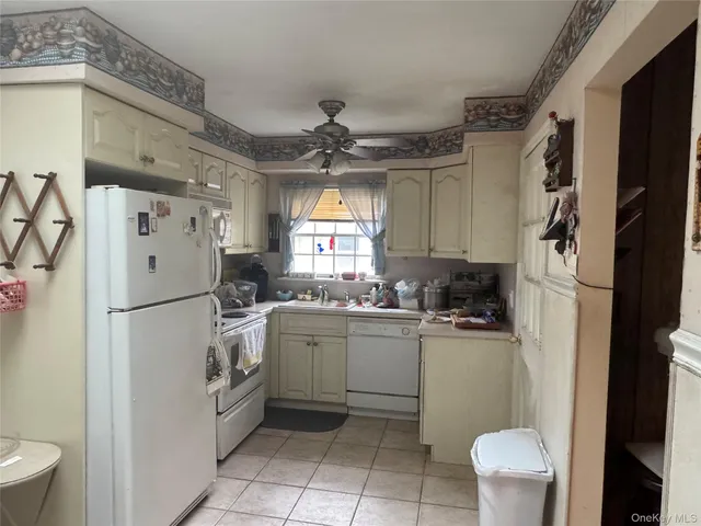 a kitchen with a refrigerator a sink and dishwasher