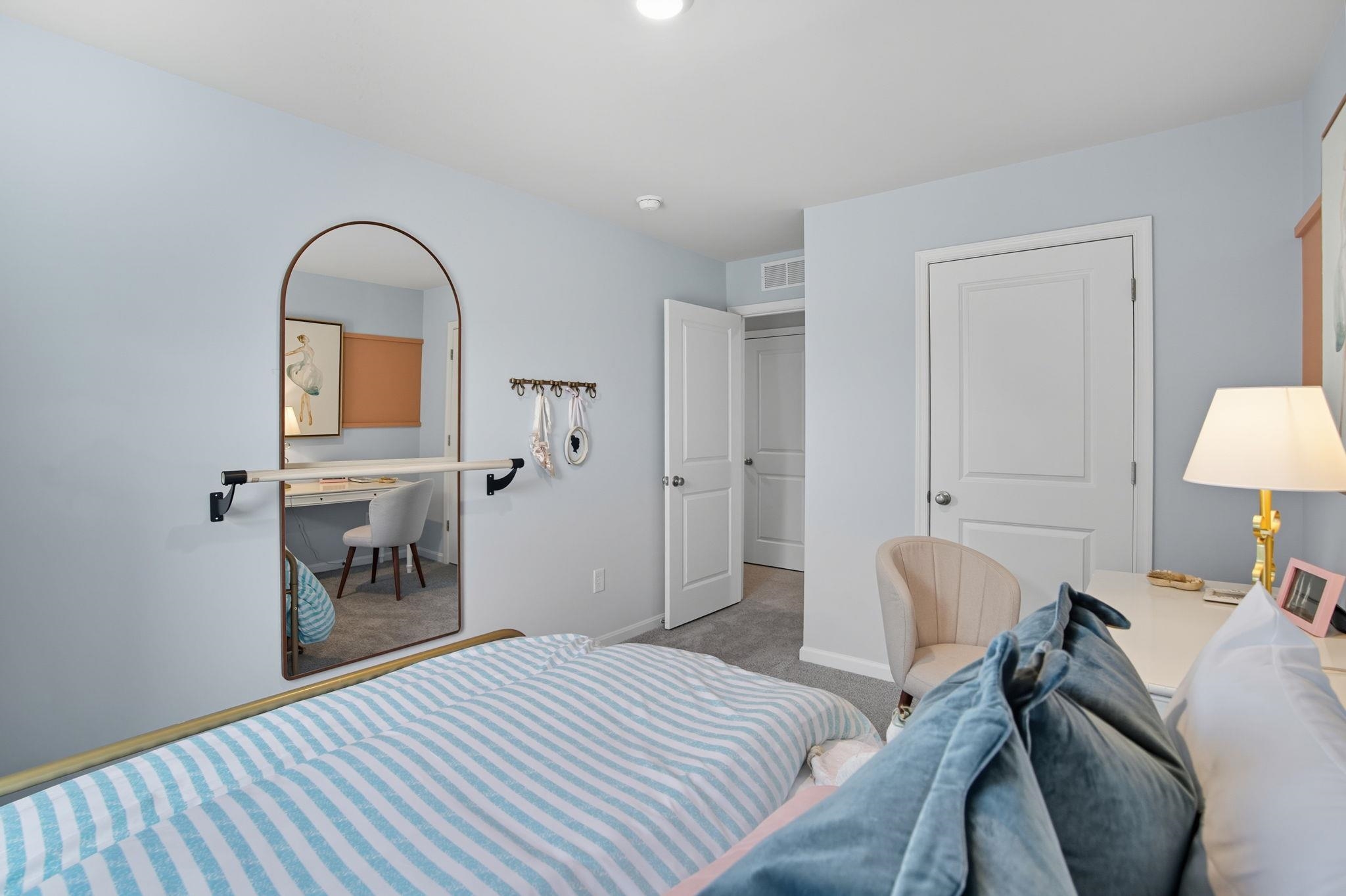 113 Meadow Ridge Way Staunton, VA 24401 - Photo 21 of 30 a bedroom with a bed and a chair