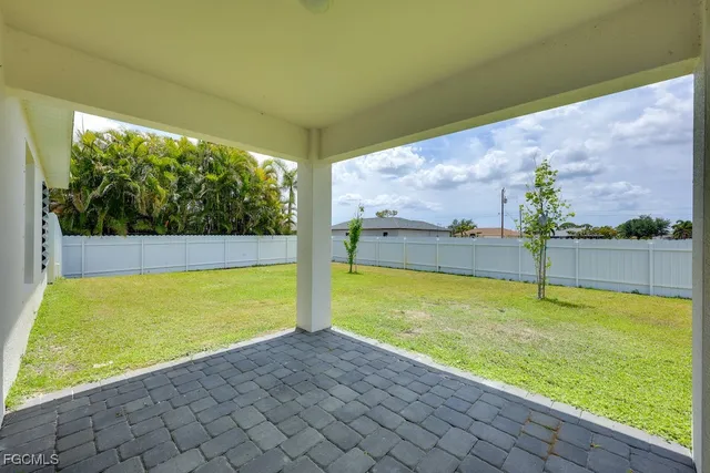 a view of a swimming pool and an outdoor seating