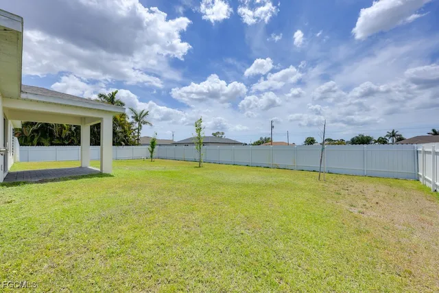 a view of a swimming pool with an outdoor seating