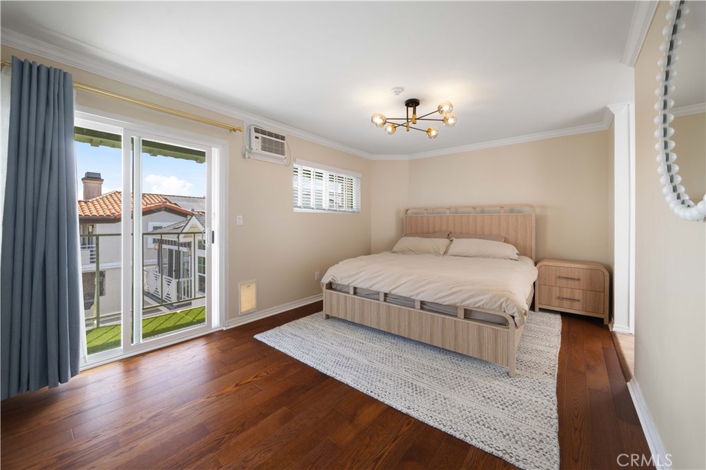 2518 Curtis Avenue, Unit 3 Redondo Beach, CA 90278 - Photo 15 of 35 a bedroom with a large bed and a chandelier