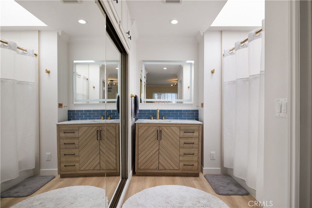 2518 Curtis Avenue, Unit 3 Redondo Beach, CA 90278 - Photo 18 of 35 a bathroom with a granite countertop sink a mirror and shower