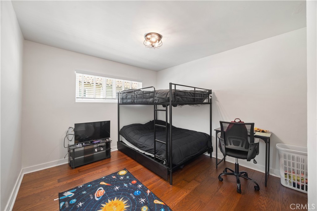 2518 Curtis Avenue, Unit 3 Redondo Beach, CA 90278 - Photo 24 of 35 a bedroom with a bed and a chair