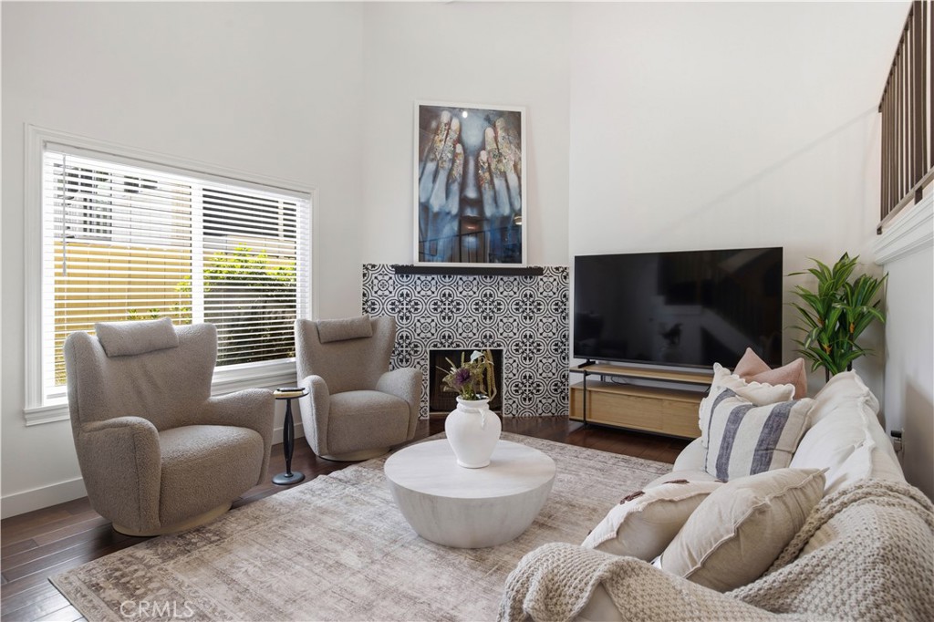 2518 Curtis Avenue, Unit 3 Redondo Beach, CA 90278 - Photo 5 of 35 a living room with furniture a flat screen tv and a fireplace