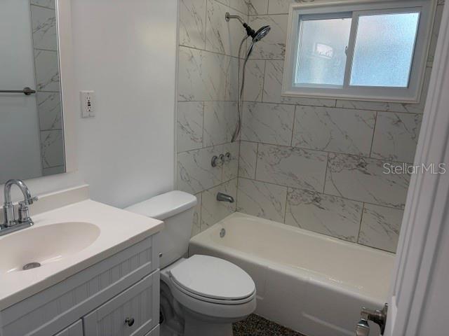 11601 109th Street Seminole, FL 33778 - Photo 17 of 29 a bathroom with a sink toilet and shower