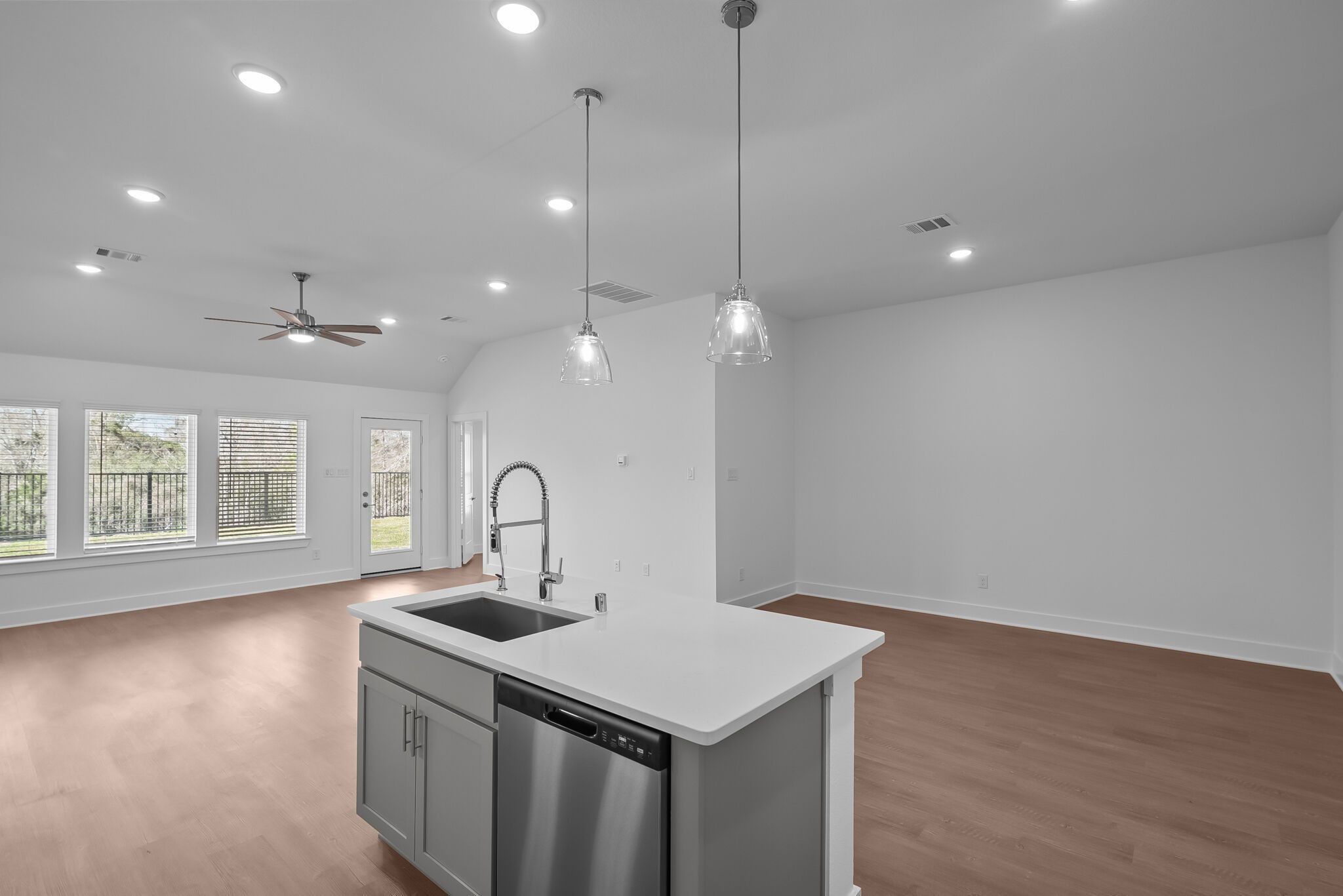 219 Conger Drive Lebanon, TN 37087 - Photo 8 of 21 a kitchen with a sink a faucet a chandelier and wooden floor