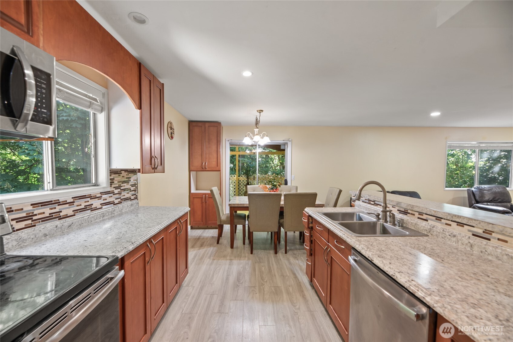 10606 68th Place South Seattle, WA 98178 - Photo 6 of 31 a kitchen with counter top space sink and wooden floor