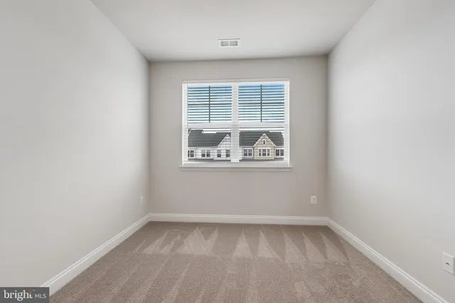 a view of an empty room and a room