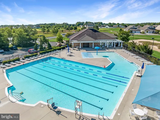 an aerial view of a house with a lake view