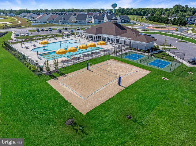 an aerial view of a house with a swimming pool
