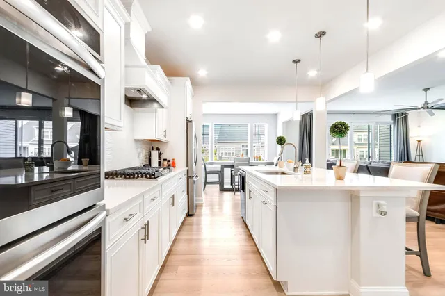 a kitchen with stainless steel appliances lots of counter top space