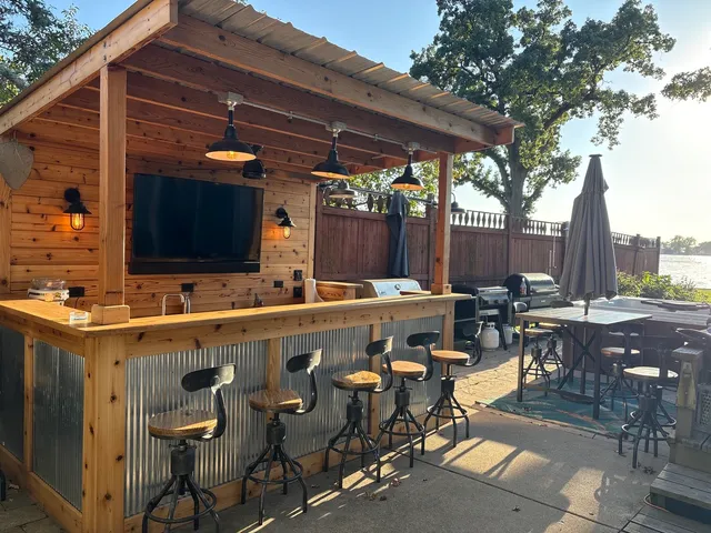 a view of a chairs and table in the patio