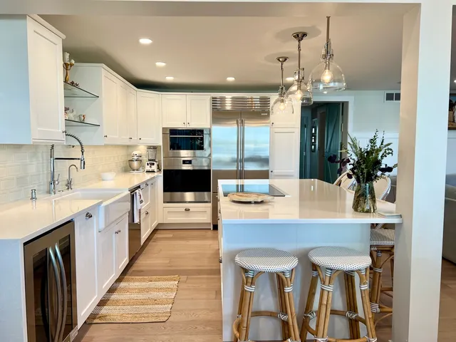 a large kitchen with a table and chairs