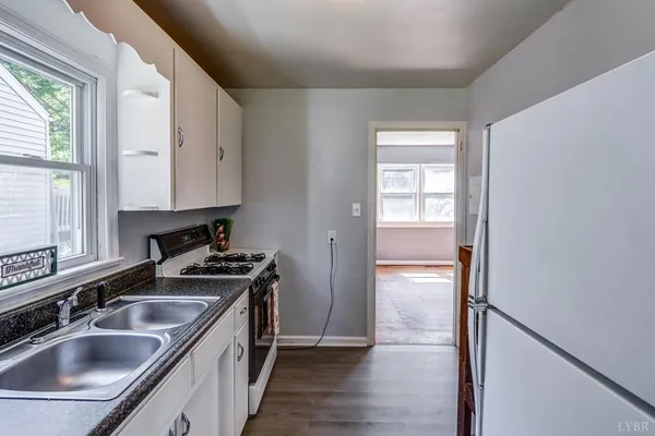 a kitchen that has a sink and a stove
