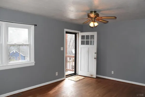 a view of an empty room with a window