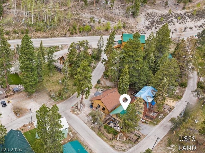 265 Rim Road Mount Charleston, NV 89124 - Photo 2 of 5 Paved 2-car driveway and a third pull-through parking space. Located in the sought-after Cathedral Rock Subdivision, you’ll have many hiking trails within walking distance ~ Little Falls, Cathedral Rock, Echo Loop, South Loop + more.