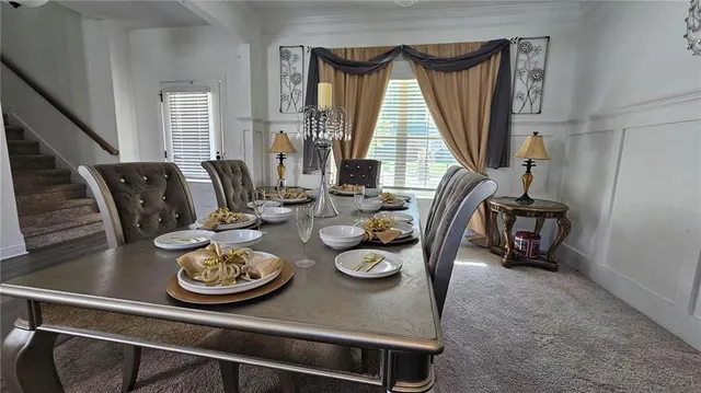 a view of a dining room and livingroom with furniture