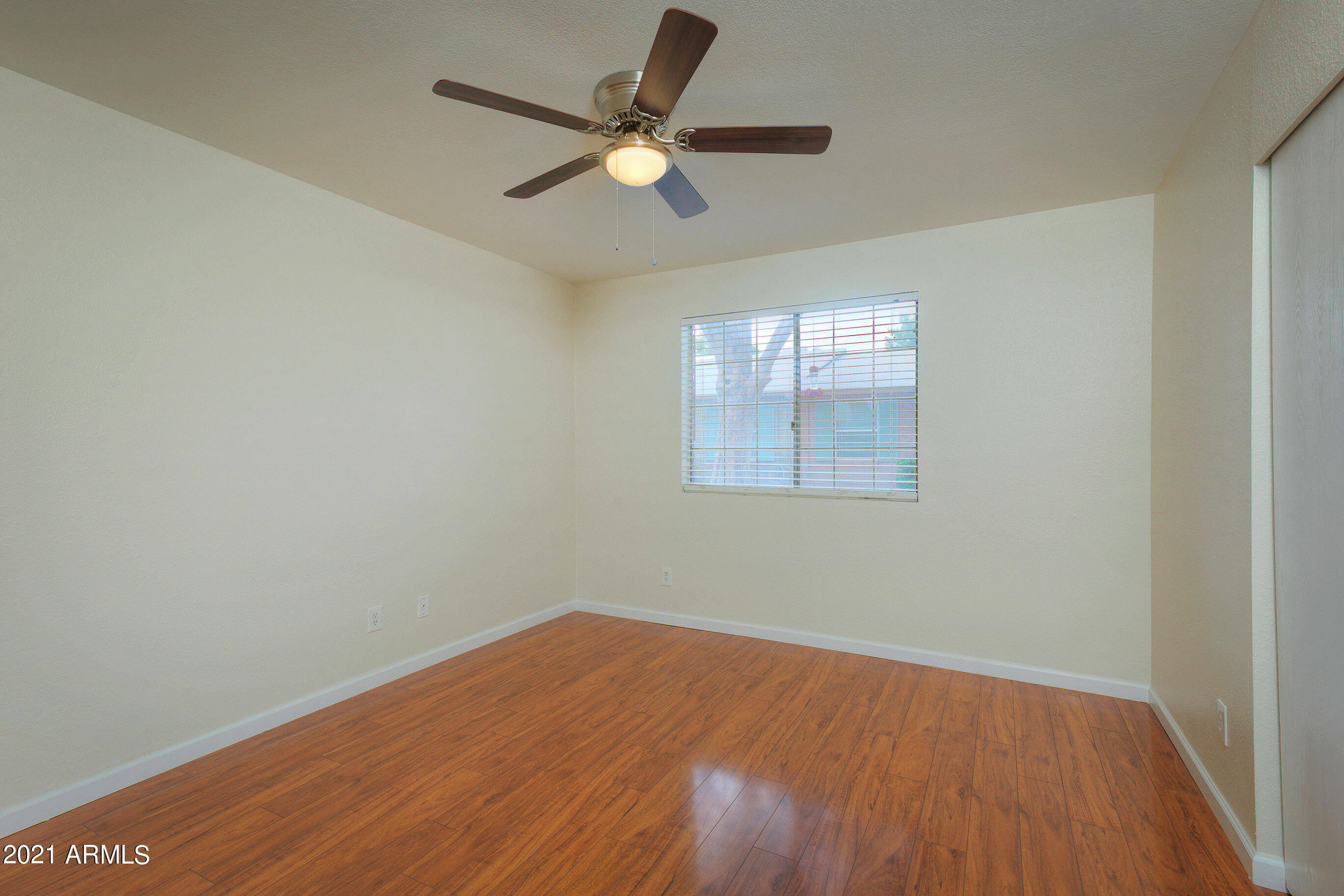 926 North Date Mesa, AZ 85201 - Photo 13 of 24 an empty room with wooden floor and windows