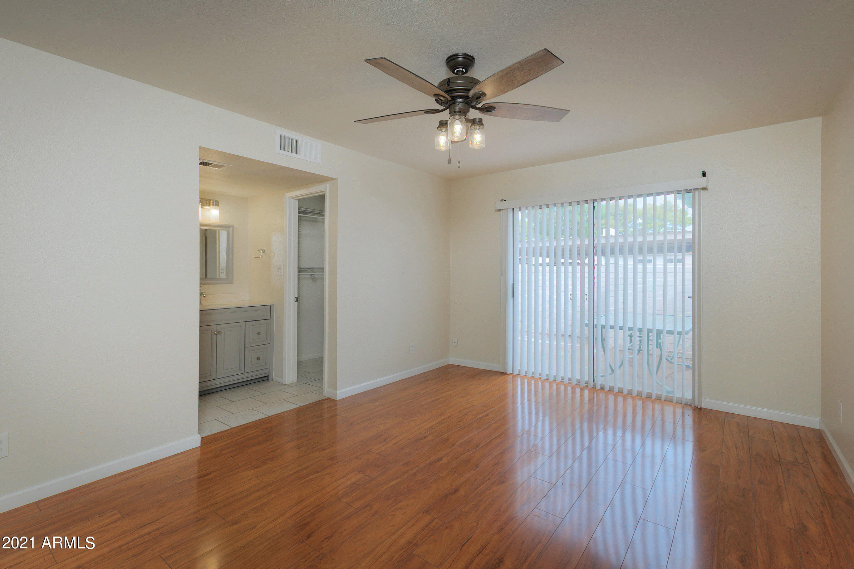 926 North Date Mesa, AZ 85201 - Photo 16 of 24 a view of an empty room with wooden floor and a window