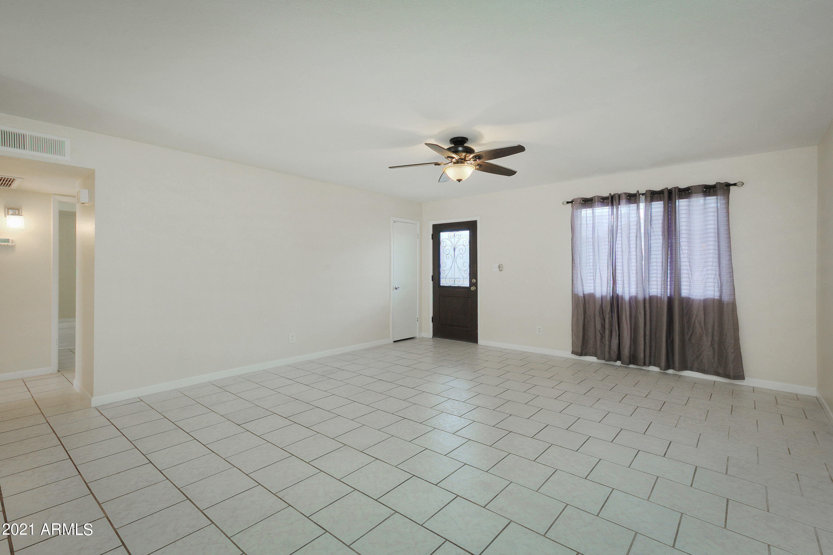 926 North Date Mesa, AZ 85201 - Photo 6 of 24 a view of an empty room with a chandelier fan