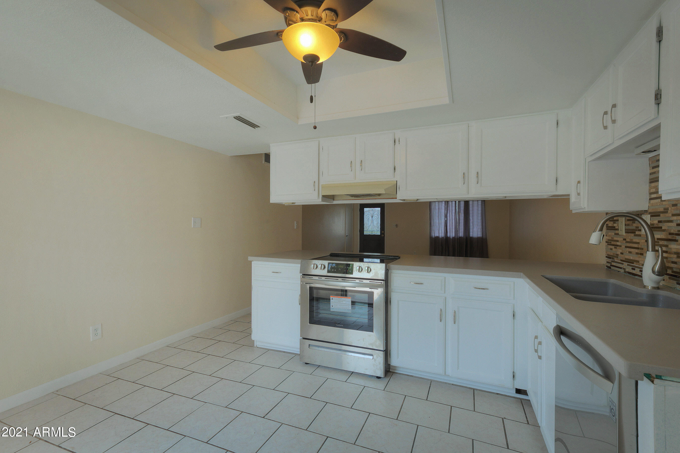 926 North Date Mesa, AZ 85201 - Photo 10 of 24 a kitchen with cabinets stainless steel appliances and a counter space