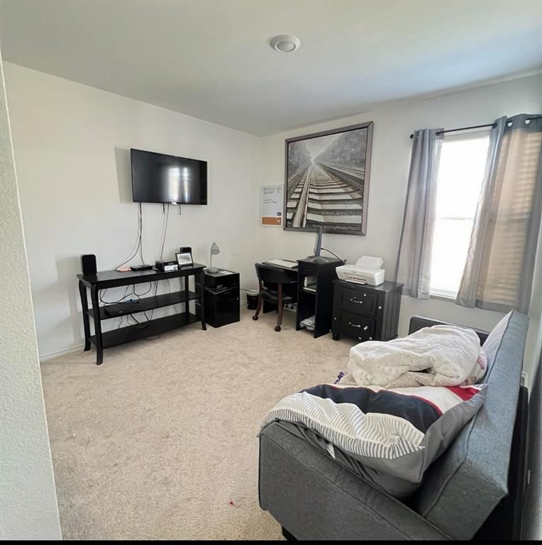 14941 Trapper Trail Haslet, TX 76052 - Photo 16 of 22 a living room with furniture and a flat screen tv