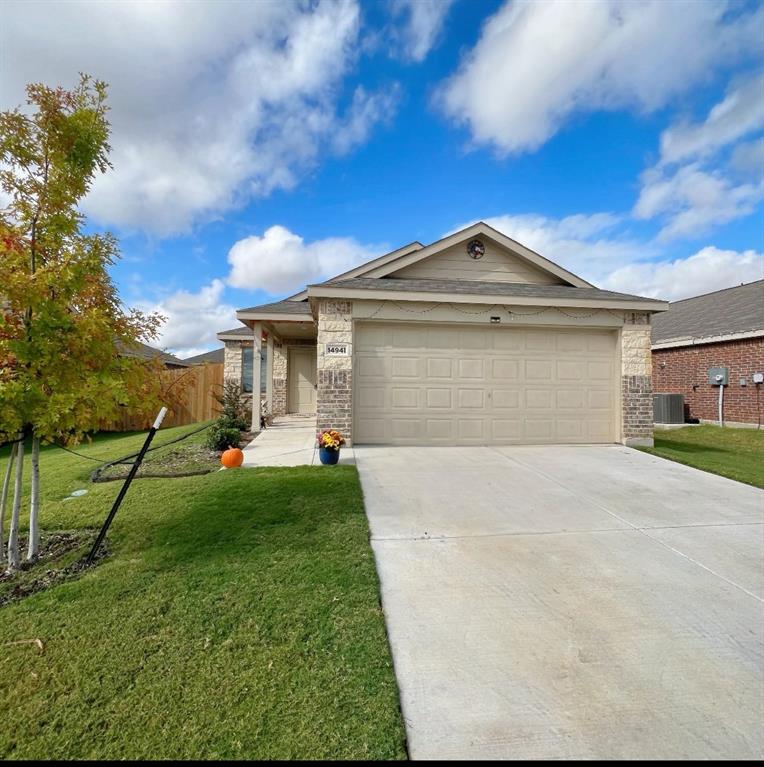 14941 Trapper Trail Haslet, TX 76052 - Photo 2 of 22 a front view of a house with a yard