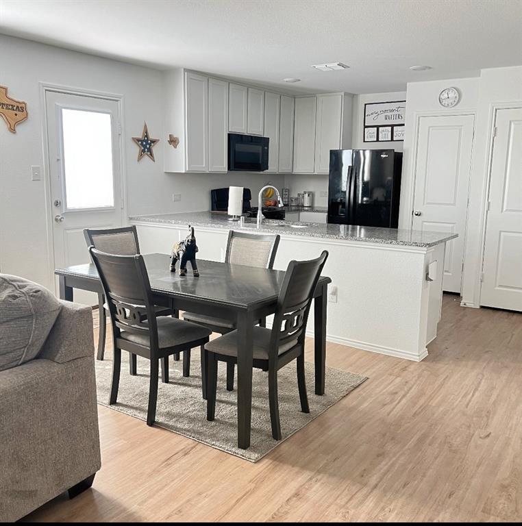 14941 Trapper Trail Haslet, TX 76052 - Photo 6 of 22 a dining room with furniture and wooden floor