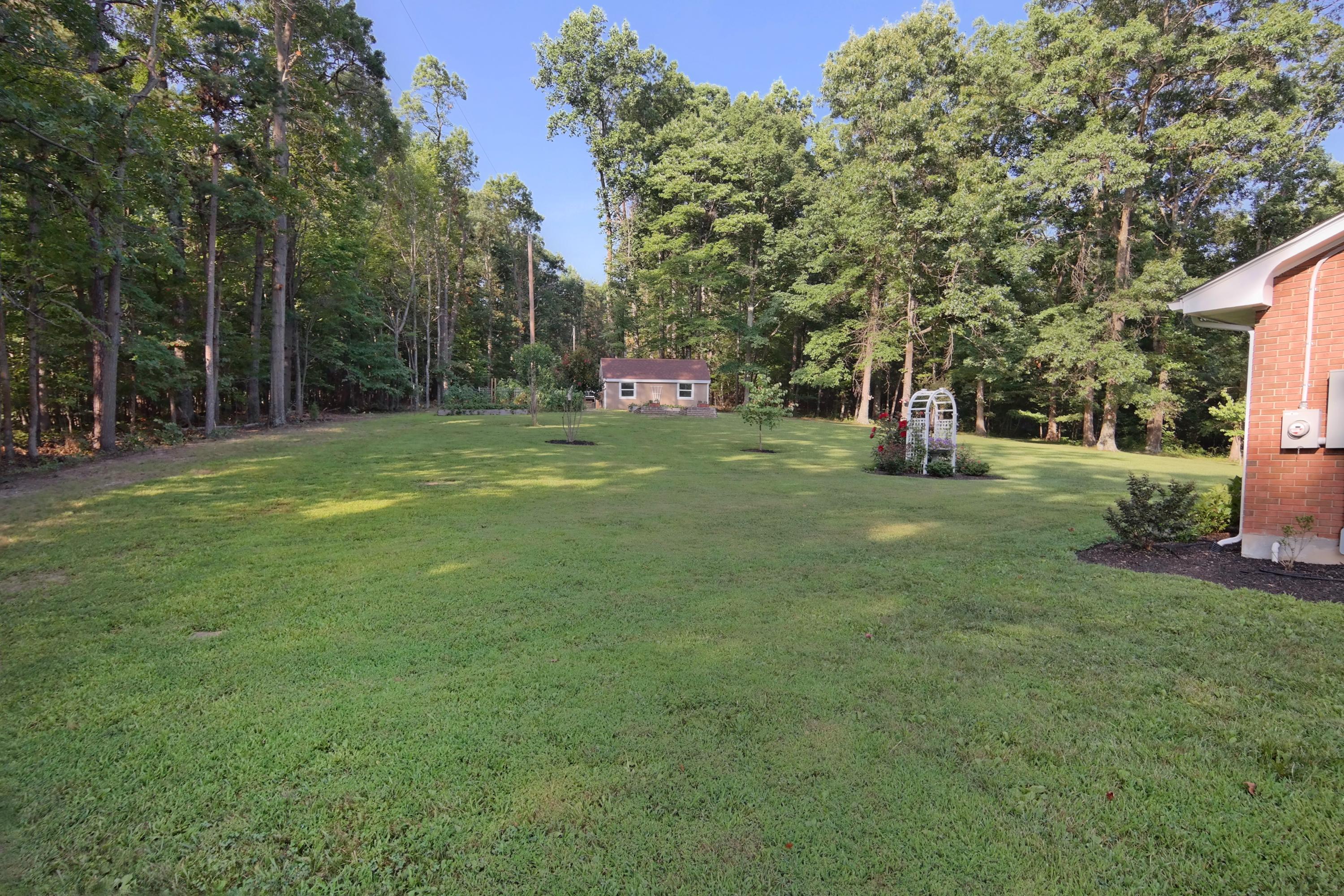 2144 Blue Ridge Springs Road Blue Ridge, VA 24064 - Photo 2 of 35 a big yard with lots of green space and trampoline