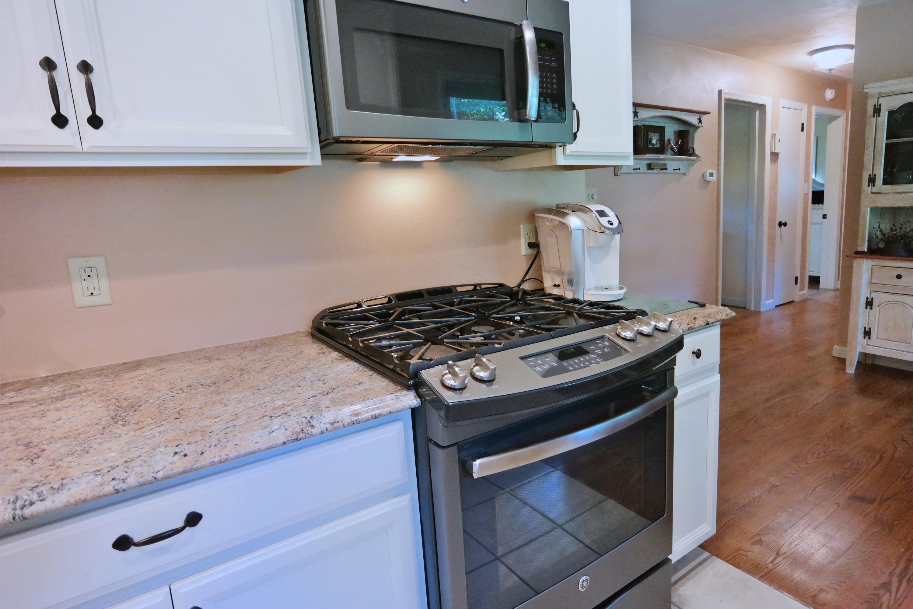 2144 Blue Ridge Springs Road Blue Ridge, VA 24064 - Photo 18 of 35 a stove top oven sitting inside of a kitchen