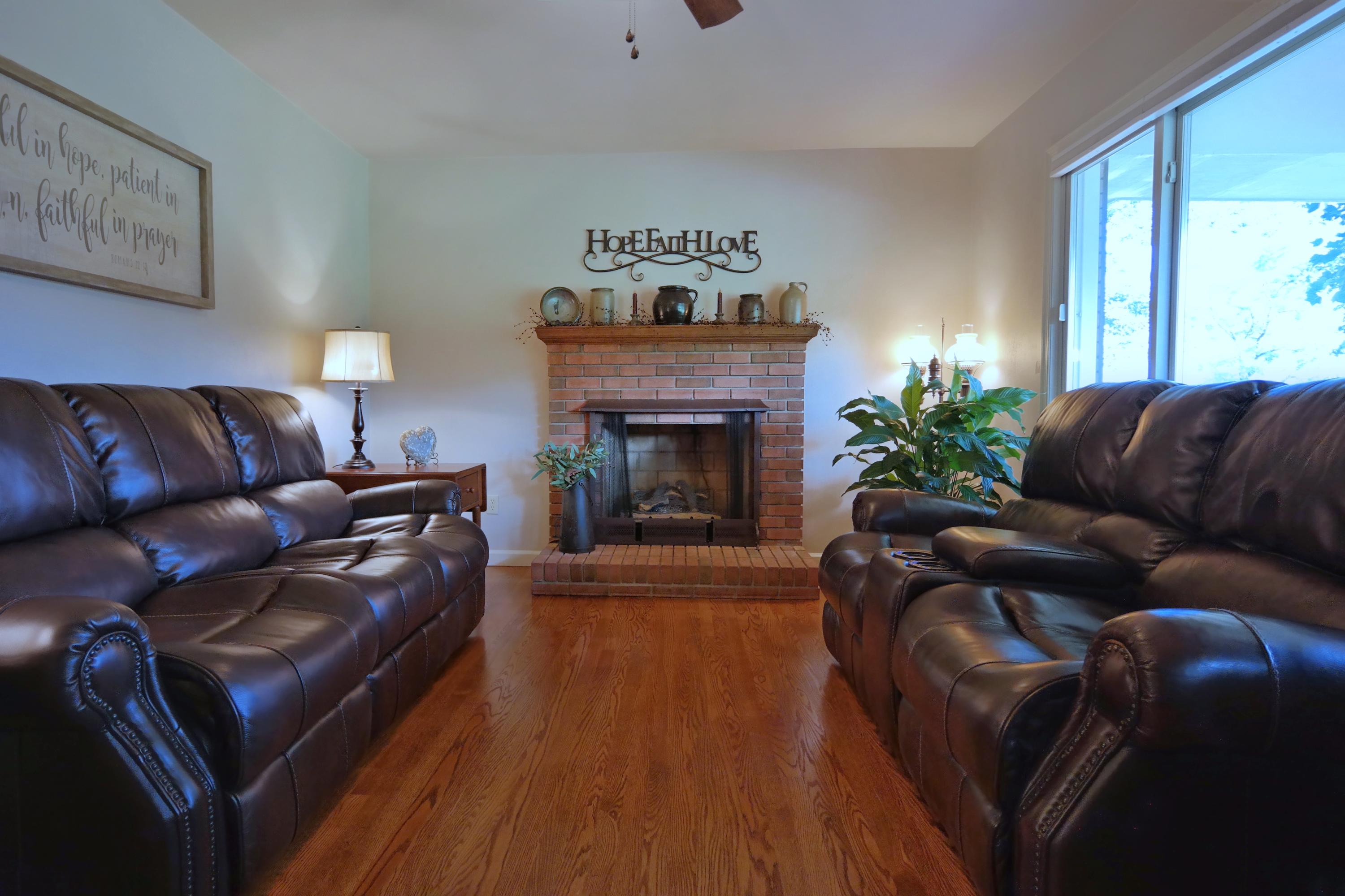 2144 Blue Ridge Springs Road Blue Ridge, VA 24064 - Photo 20 of 35 a living room with furniture and a fireplace