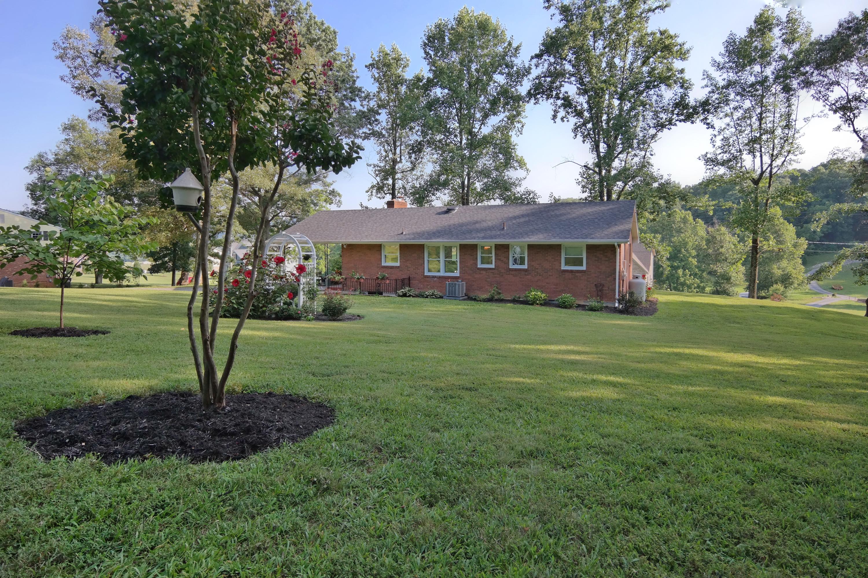 2144 Blue Ridge Springs Road Blue Ridge, VA 24064 - Photo 3 of 35 a view of a house with a garden