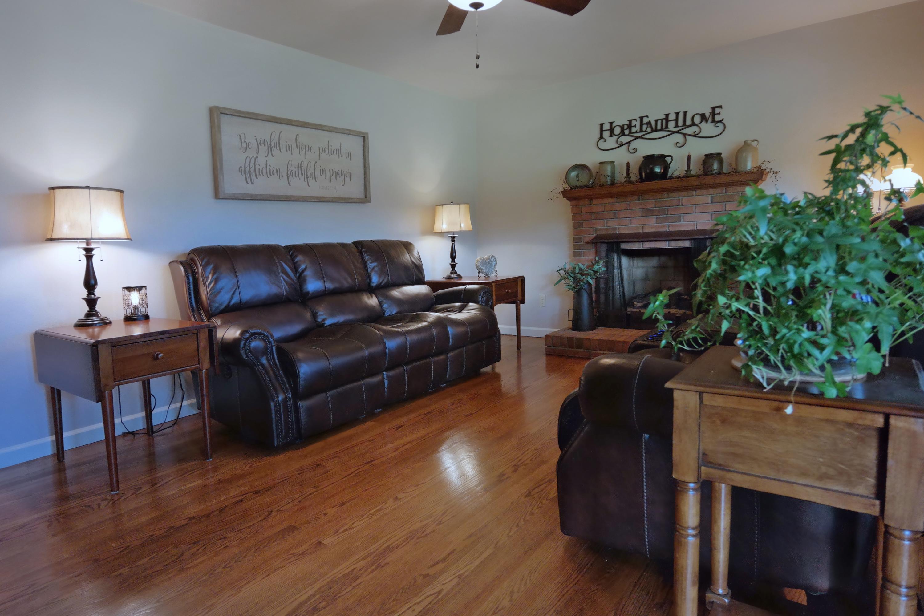 2144 Blue Ridge Springs Road Blue Ridge, VA 24064 - Photo 21 of 35 a living room with furniture and a fireplace