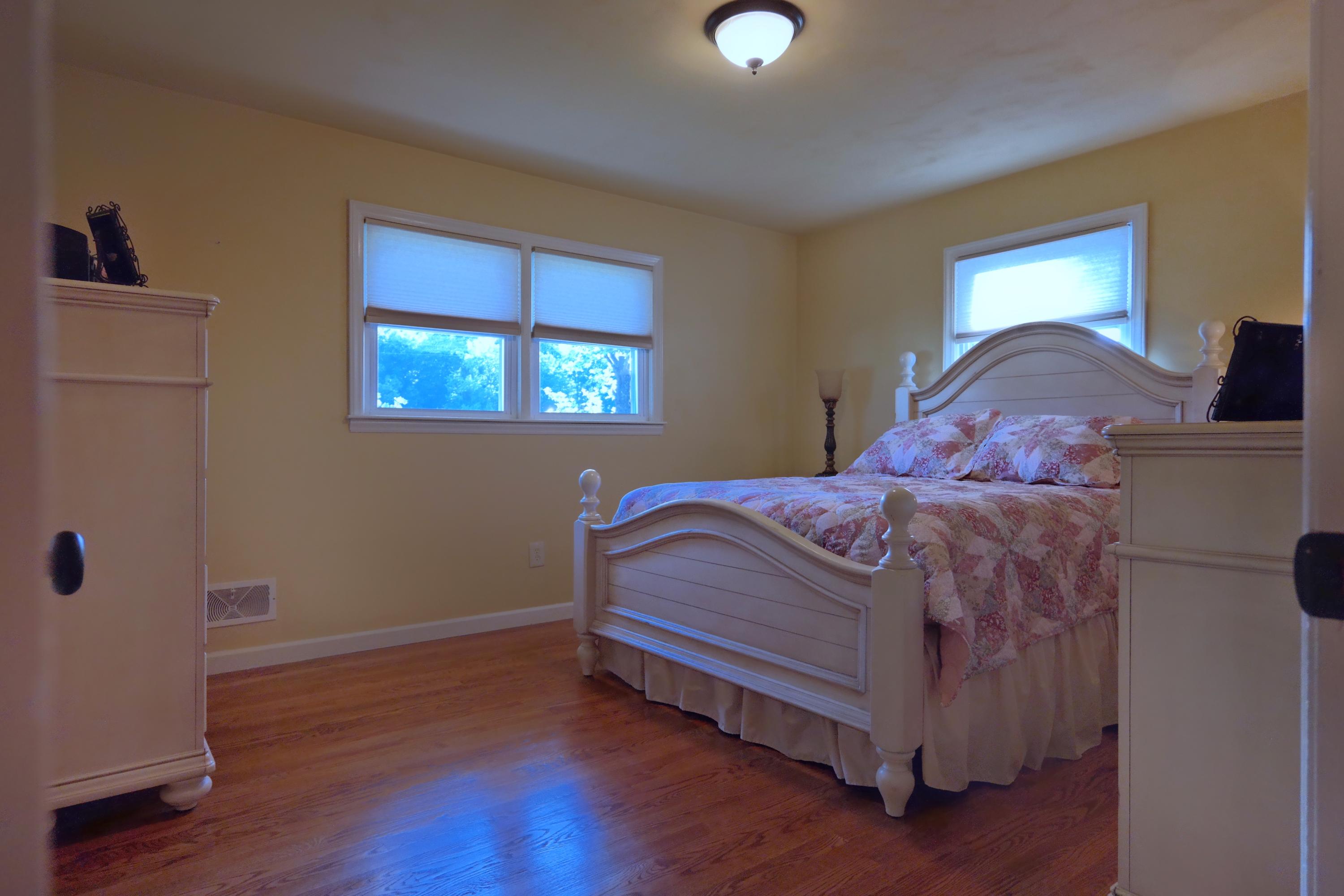 2144 Blue Ridge Springs Road Blue Ridge, VA 24064 - Photo 25 of 35 a bedroom with a bed and a window