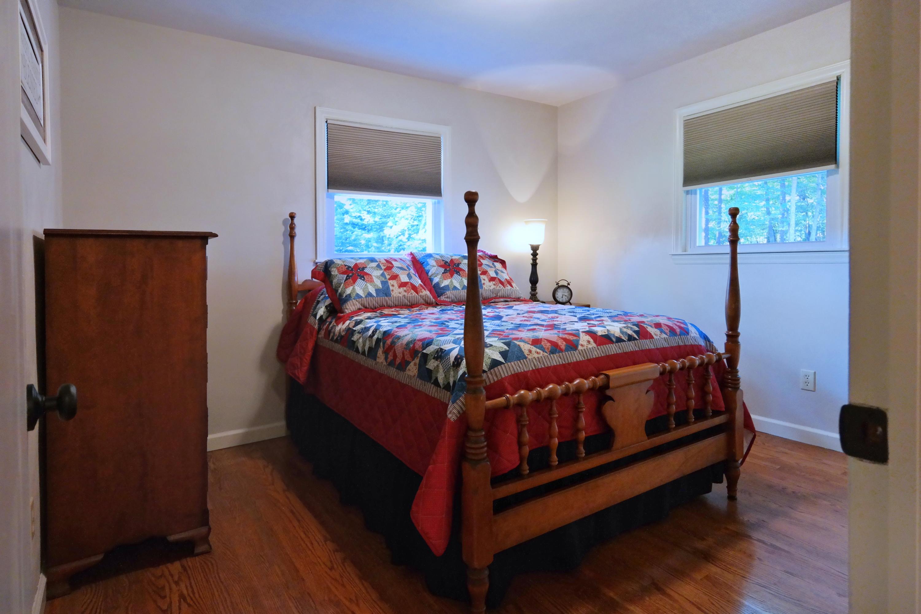 2144 Blue Ridge Springs Road Blue Ridge, VA 24064 - Photo 26 of 35 a bed sitting in a bedroom next to a window