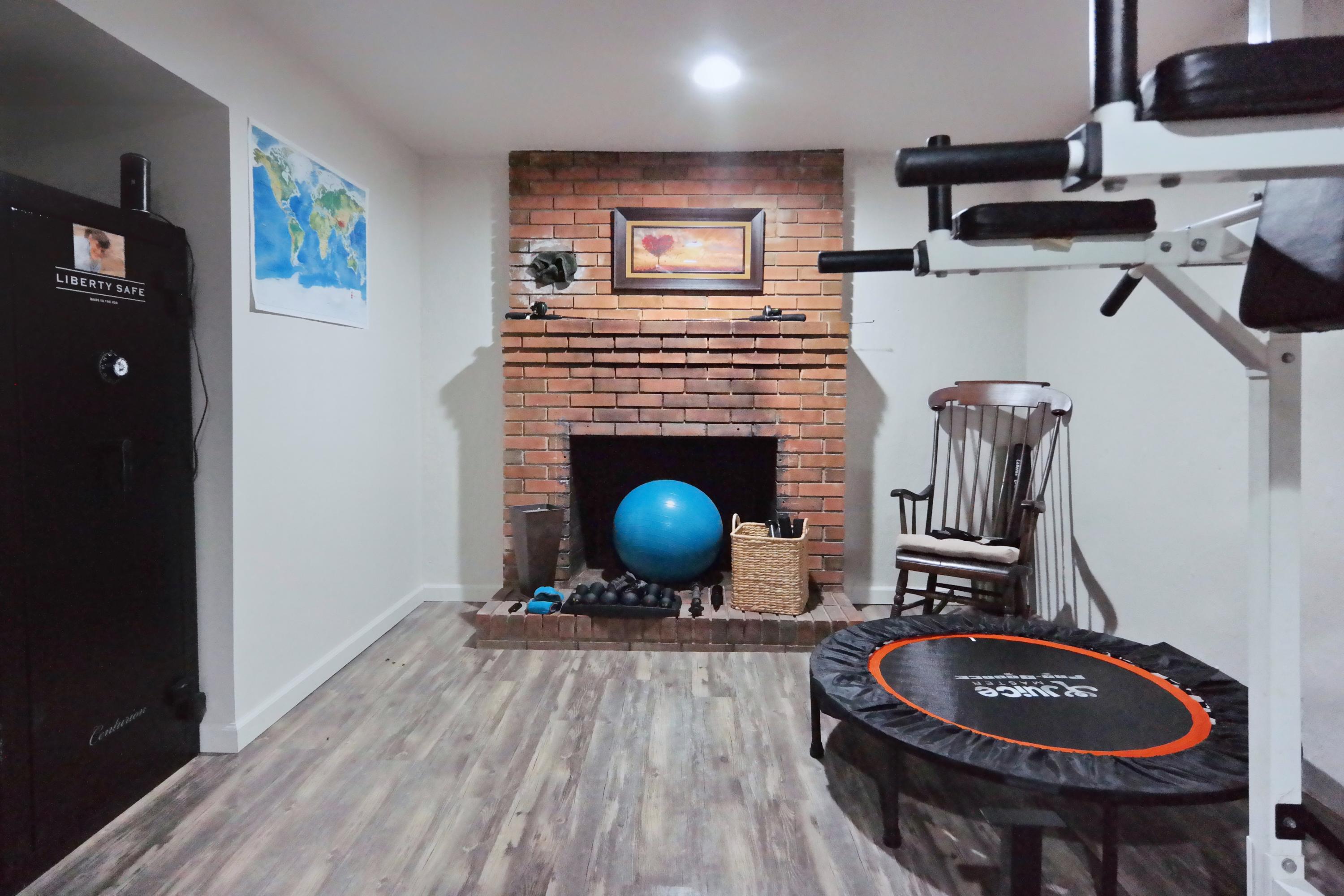 2144 Blue Ridge Springs Road Blue Ridge, VA 24064 - Photo 29 of 35 a living room with furniture a rug and a fireplace