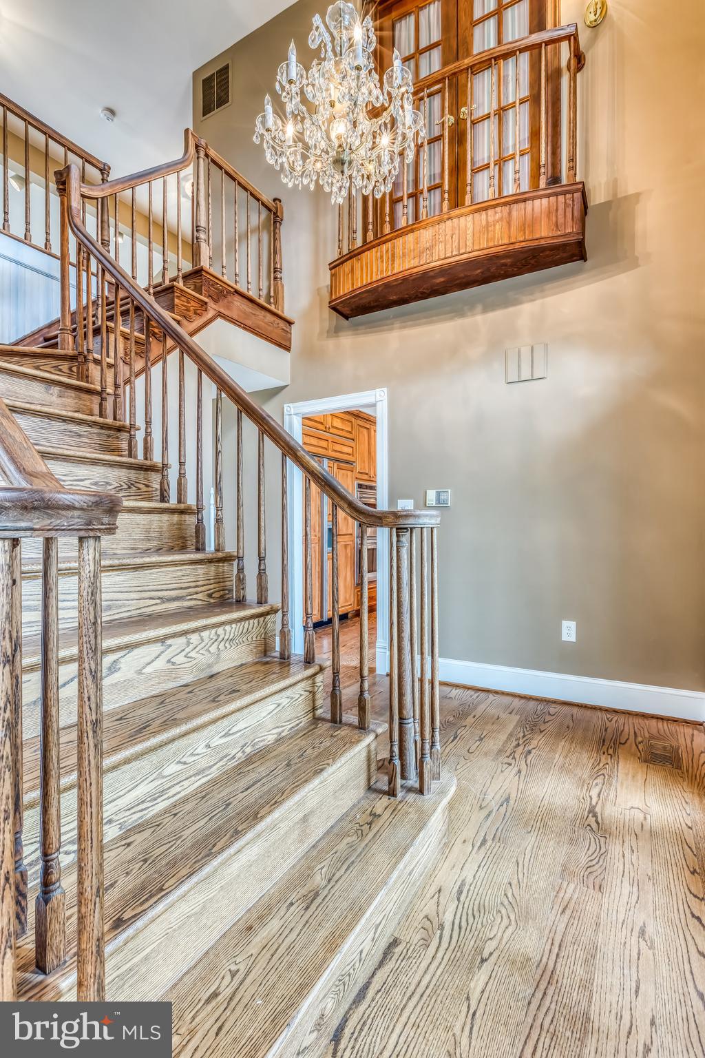 Entryway staircase with Juliet balcony
