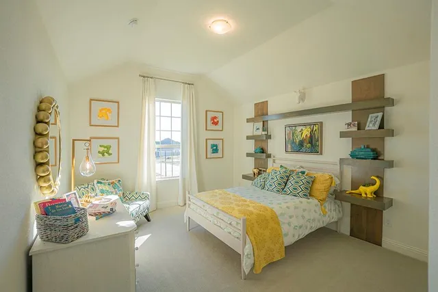 a bedroom with a bed and dresser