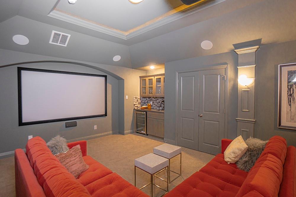 330 Aeronca Drive Fate, TX 75087 - Photo 23 of 32 a projector room with a couch and a flat screen tv