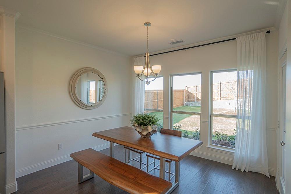 330 Aeronca Drive Fate, TX 75087 - Photo 8 of 32 a view of a room with furniture window and wooden floor