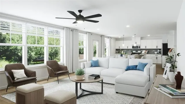 a living room with furniture and a large window