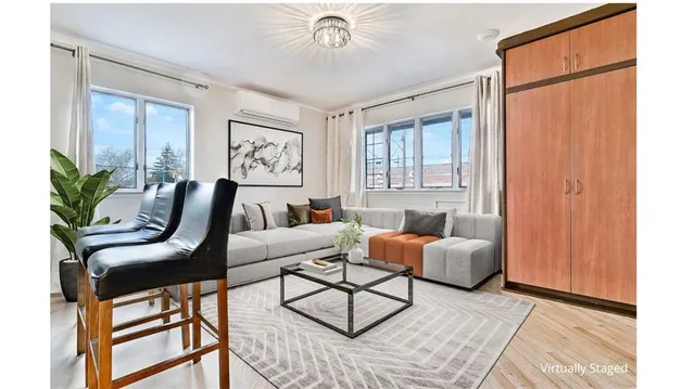 a living room with furniture and a window