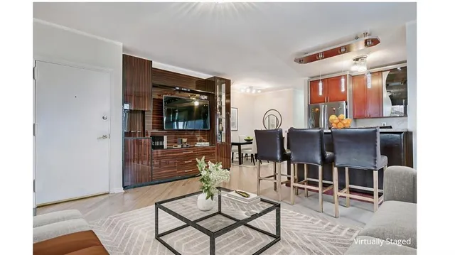 a living room with furniture and flat screen tv