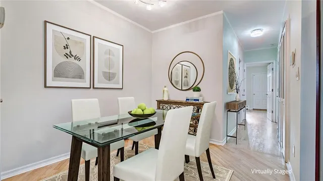 a view of a room with furniture and wooden floor