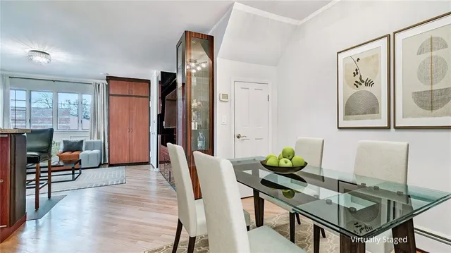 a view of a livingroom with furniture and a potted plant